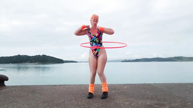 Sexy granny Joy Donaldson hula hooping in a captivating GIF