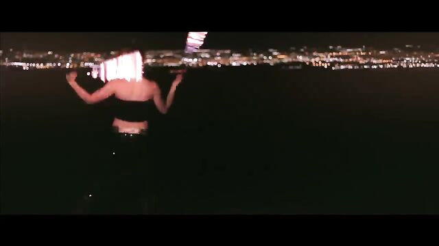 A sexy woman named Rachel Jessee is dancing with fire and showing her body