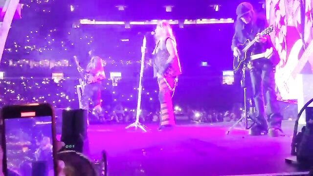 Busty girls took off their shirts during Motley Crue's live show in Cleveland stadium