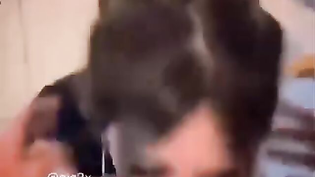 Elle licks his cock without stopping, giving him her all