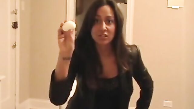 The princess fiercely grips the balls with her hand until they are white