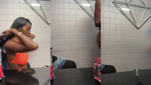 A hot guy is changing his clothes in the locker room of the gym