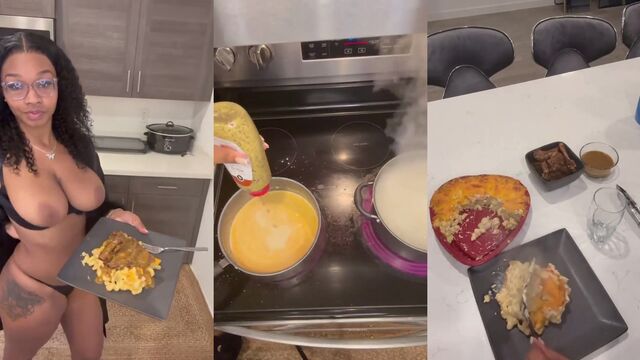 A hot chick is cooking something spicy in the kitchen