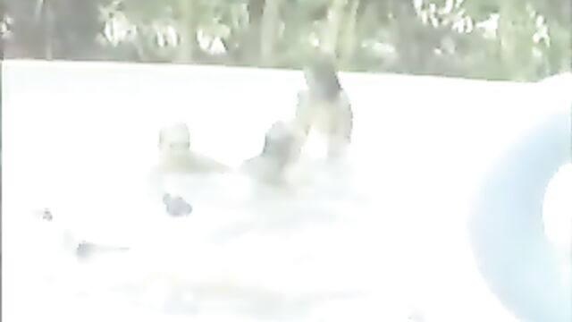 A group of girls have fun in the pool without any clothes