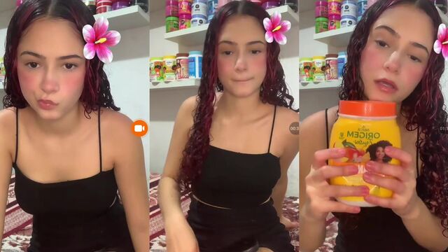 A young woman shows her perfect body in a short skirt