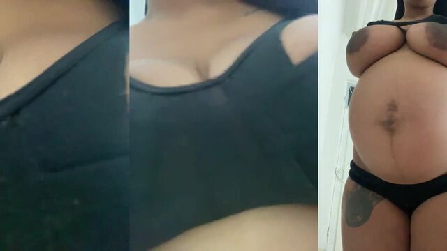 A beautiful woman is milking her huge natural boobs