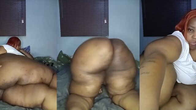 Fat African woman shows her huge ass while stripping and moaning