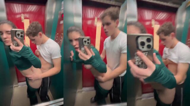 A girl is having fun with her boyfriend in the elevator