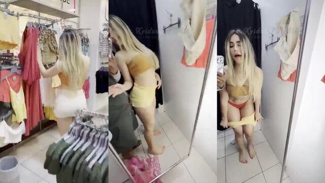 Blonde woman trying on clothes, gets fucked in the dressing room