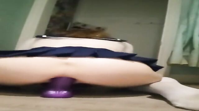 A young schoolgirl is getting fucked deep in her ass hole