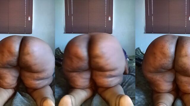 Fat black African woman shows her huge ass in stockings