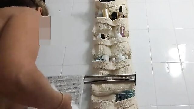 Spycam voyeur catches hot MILF in the bathroom, peeing and more