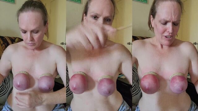 A masochist woman gets her nipples tortured with a vibrator