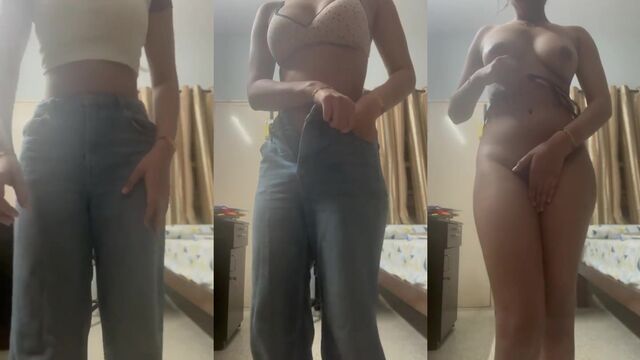 A hot Indian girl is taking off her clothes and showing her boobs