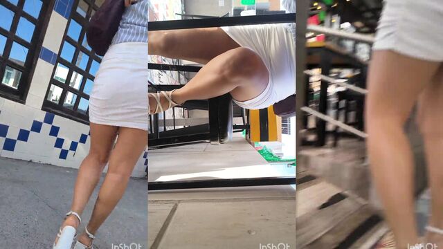 A girl was caught upskirt, her panties are completely visible
