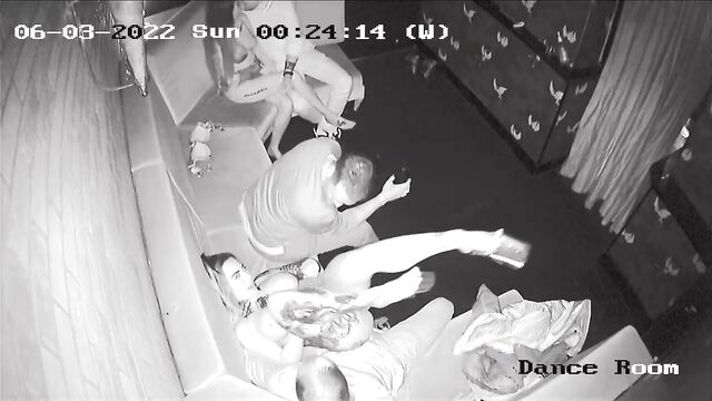 A strip club security camera captured a surprising moment of intimacy